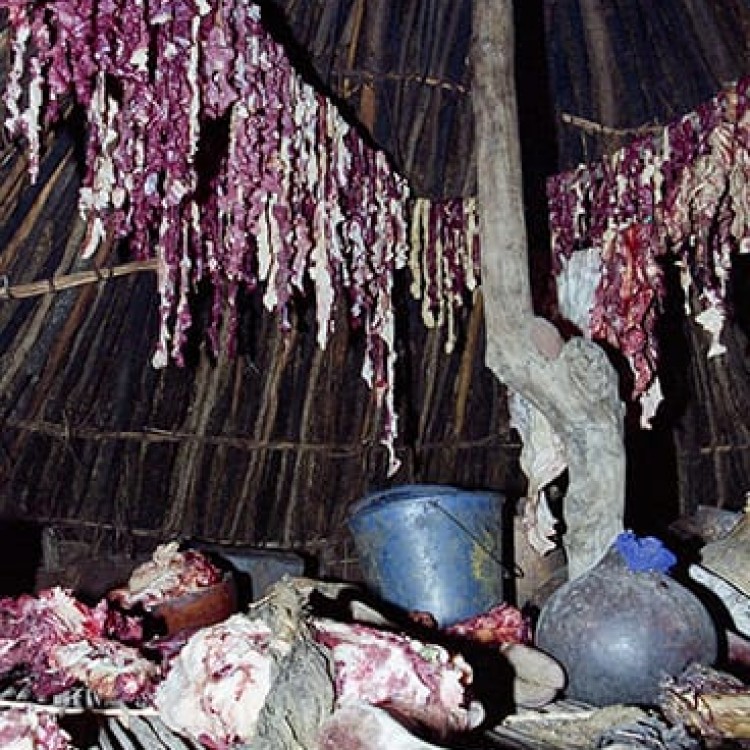 Chase | Ethiopia - 156-32 Raw goat meat drying on hut rafters