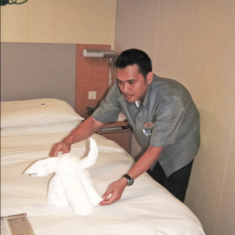Crew member making bed